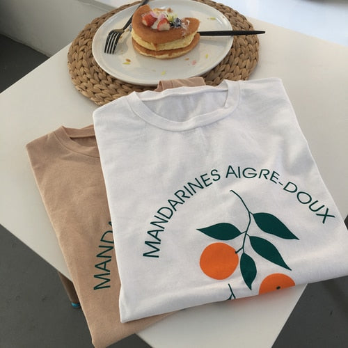 Women Orange Printed Short Sleeve T- Shirts DromedarShop.com Online Boutique